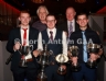North Antrim Cultural Officer Jimmy Gaston and Sean McKendry with Loughgiel Shamrocks players who received awards on behalf of their teams. L-R, Gillan (Senior Reserve Championship), Shay Casey (Senior Feis Cup and Division 1 League), C (Junior League and McCaughan Cup)