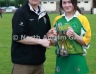 North Antrim GAA Chairmain Owen Elliott presenting Cuchullians Dunloy captain Katie Laverty with the U16 Feis Camogie Trophy