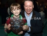 Philip McHendry from Central Restaurant Ballycastle presenting Eoghan Roe 2 team captain Hugh Patrick with the North Antrim Central Bar Division 5 Indoor Hurling league shield