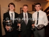 North Antrim Chairman Owen Elliott who presented the Minor Hurling Championship and the Darragh Cup to Dunloy Cuchullains captain Adam Mullan (left) and the Under 16 Shield and McMullan Cup to Under 16 captain Declan Smyth