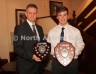 North Antrim Chairman Owen Elliott presents the North Antrim U16B Championship and U16B Shield to Declan Mallon of Tir na nOg, Randalstown