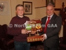 Antrim County Vice-Chairman Joe Edwards presents the Fiele na nGael A Shield to Loughgiel captain Declan McCloskey