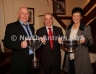 Antrim County Vice-Chairman Joe Edwards presents the Antrim and Ulster Intermediate Hurling Championship Cups to Tommy and Mary McCann of Creggan Kickhams